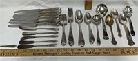 Large assortment of flatware with floral pattern