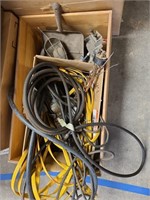 An assortment of electrical cords and lighting, me