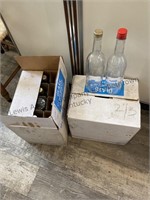 Two boxes of empty wine bottles