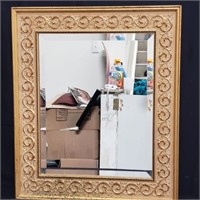 Gilt-framed wall mirror