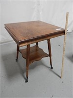 Parlor table with glass claw feet; approx. 24"x24