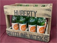 Huberty crate full of large bottles