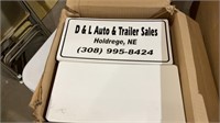 Box of D&L auto & trailer sales plates