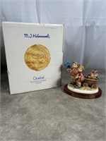 Hummel figurine called Loves Bounty, numbered