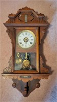 Antique wall clock with thermometer