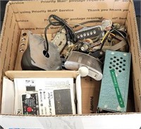 Box of electric guitar parts, flask etc