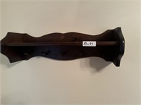 Dark wood peg shelf