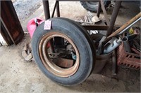 Tractor tire, jack, steel rods, etc