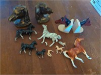 Collection of horse figures and book ends