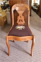 Antique chair with needlepoint seat, damage to