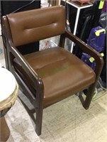 Brown wood arm chair with leather-like cushioned