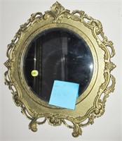 Mirror in round ornate frame