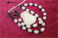 Necklace w/ carved white Buddha Pendant