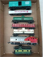 7 asst HO scale train cars/engine