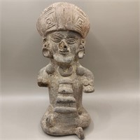 Pre-Columbian clay figure sitting cross-legged
