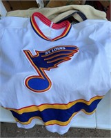 Blues jersey w/ bag hockey equipment