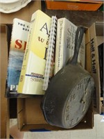 cast iron pan clock, assorted books
