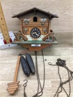 Wood cuckoo clock with weights and pendulum