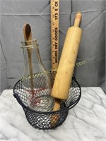 Basket with milk bottle, rolling pin and wooden