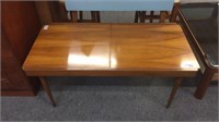 MID CENTURY COFFEE TABLE WITH SLIDE OUT FEATURE,