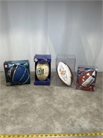 Assortment of footballs, basketballs, and display