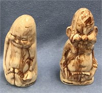 2 ceramic casts of a Buddha and one of a billiken,