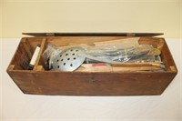 Vintage ice fishing tools in wooden box