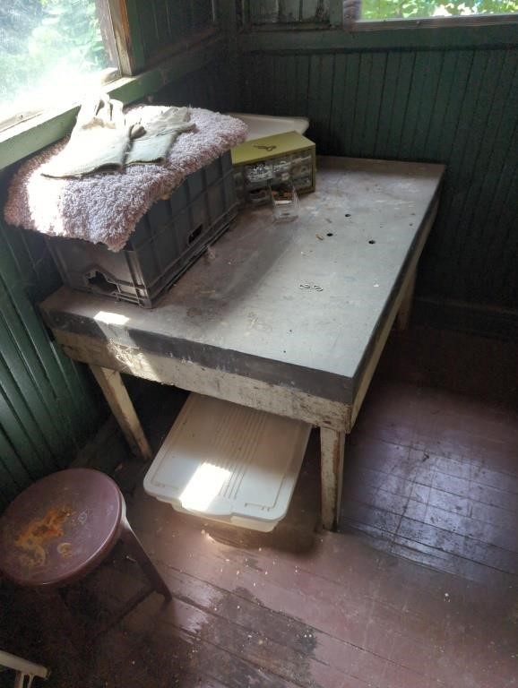 Homemade metal top wooden table