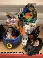 Assorted holiday decor items. Masks, ceramic