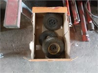 2 lawn mower wheels and 1 tire
