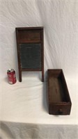 Antique wooden washboard and a sewing machine