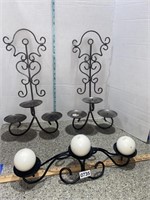 Metal wall sconce for use with candles. Black