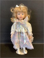 Porcelain Doll with stand 17"h