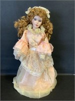 Numbered Z8553 Porcelain doll with stand 19"h