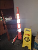 Caution cone and caution sign