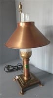 Brass style desk lamp with chimney and paw feet.