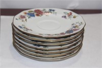 Set of 7 Limoge Saucers