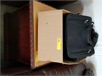 Damaged end table, box of laptop cases & book