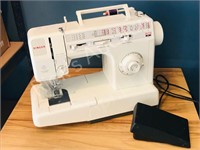 portable Singer sewing machine - working