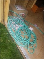 Group of garden hose. Appears 2 be 2 large ones