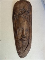 Wall hanging clay face measures 25 inches