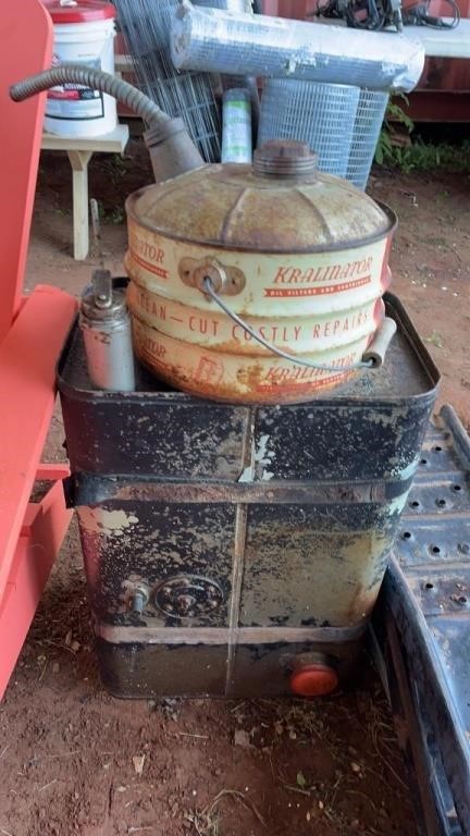 AN EARLY FUEL CAN, A VINTAGE FUEL TANK, AND OIL