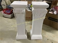 2 white pedestals