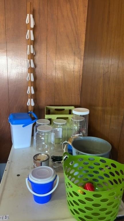 Crate, plastic jugs, basket, bucket
Tabletop