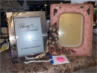 PAIR OF THEMED PICTURE FRAMES