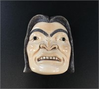 Tlingit mammoth ivory carving of a young man's fac