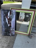 Framed mirror and snow house picture