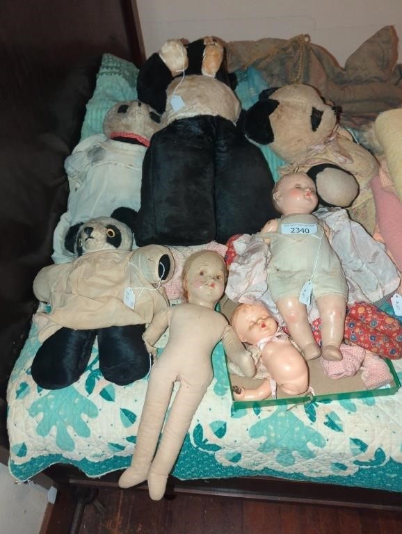 Various antique dolls and stuffed animals