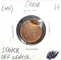 Error off-center Lincoln Cent coin.