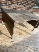 Drop leaf table approximately 8 foot long